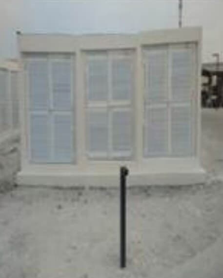 Precast modular building exterior with louvred panels