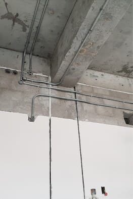 Conduit installed on concrete soffit