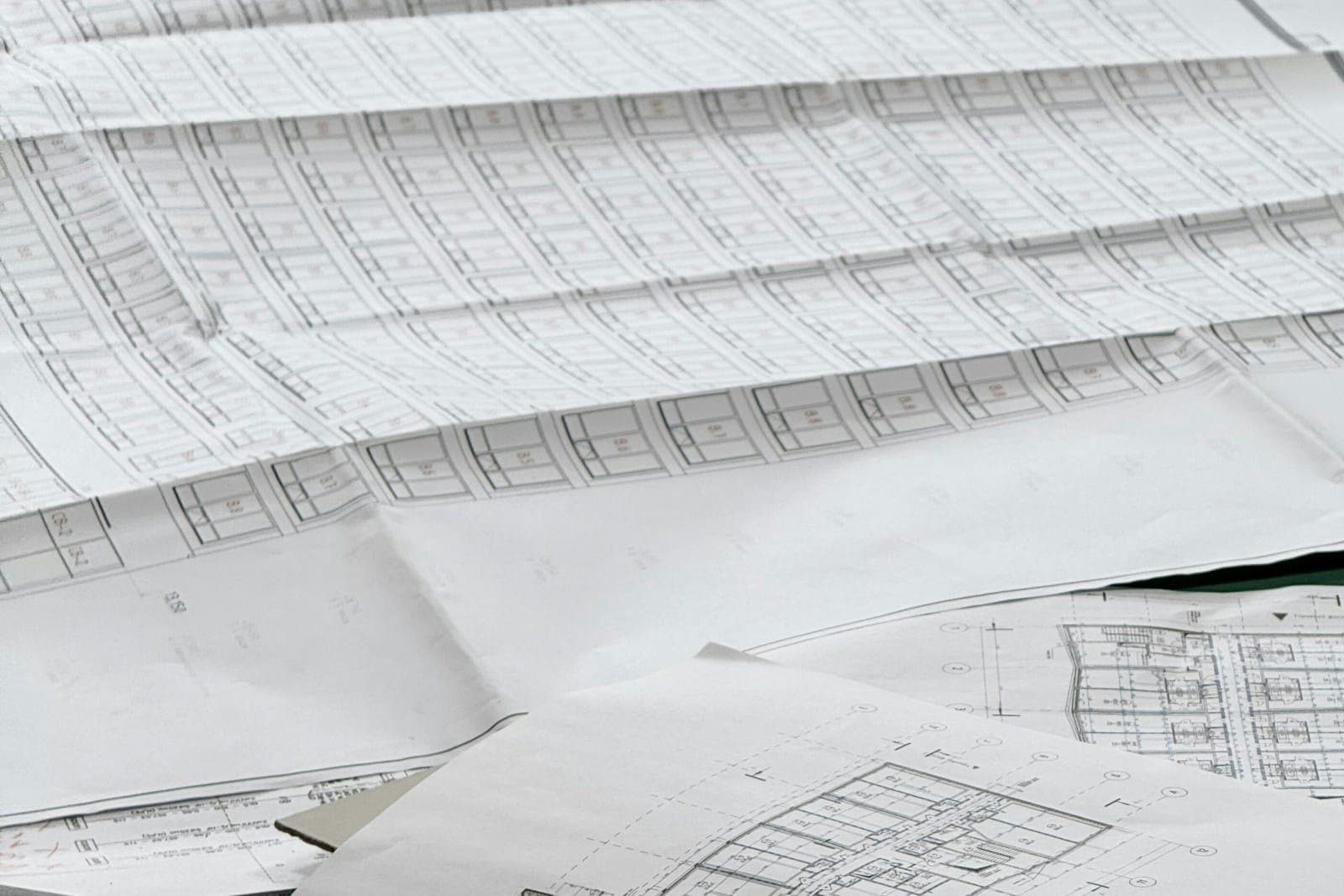 Engineering drawings spread across a desk